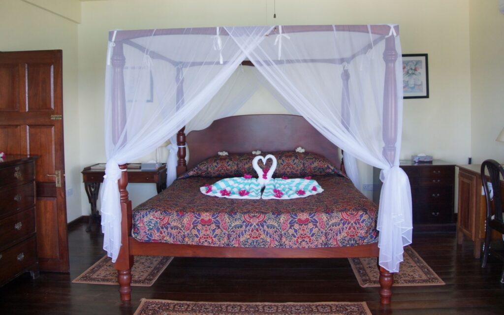 Honeymoon suite bed at Petite Anse Hotel in Grenada.