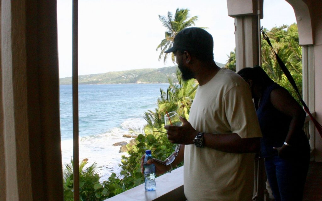 Guest relaxing at Petite Anse Hotel after exploring northern Grenada
